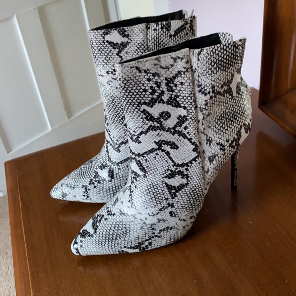 Black and white snake skin boots